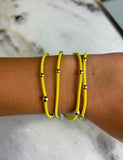 E Newton "e" essentials Bracelet/Ponytail Holder Yellow