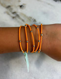 E Newton "e" essentials Bracelet/Ponytail Holder Orange