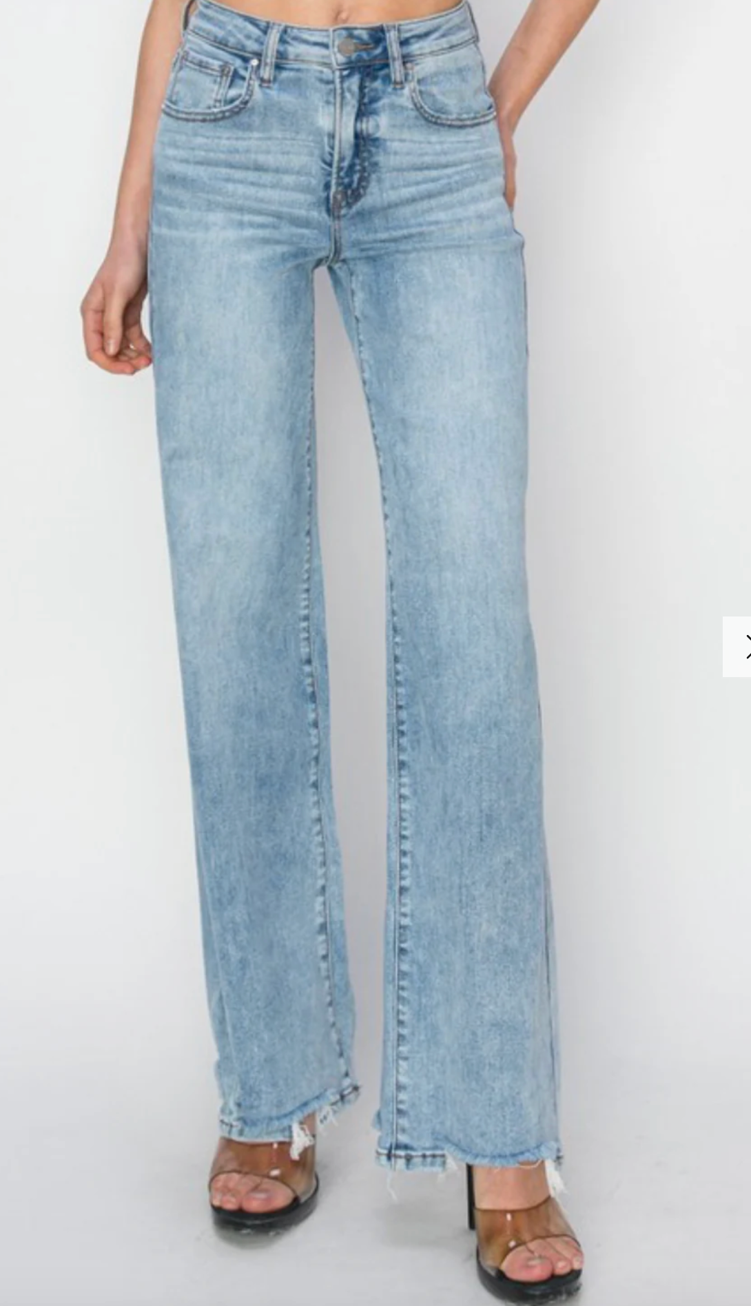 Risen High Rise Wide Leg Step Hem Jeans
